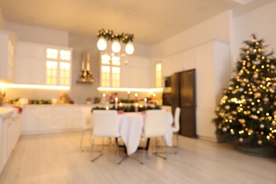 Blurred view of cozy kitchen decorated for Christmas. Interior design