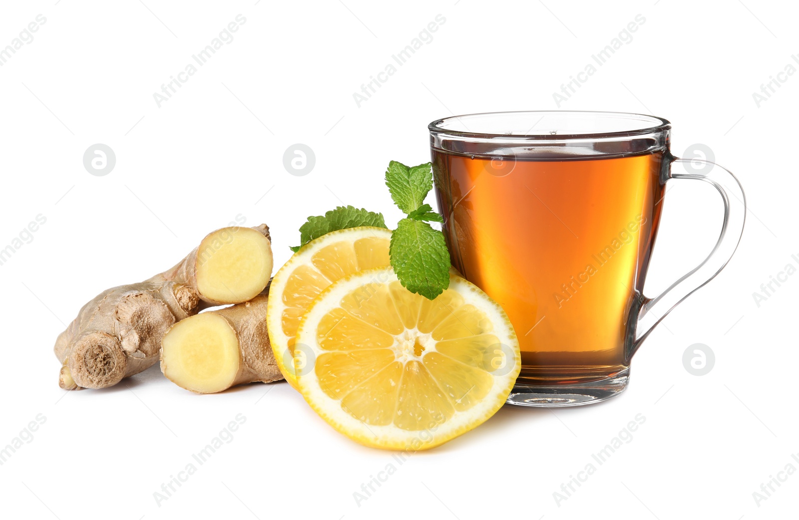 Photo of Glass cup of tea, lemon slices and ginger on white background