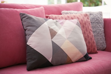 Photo of Sofa with colorful pillows in living room