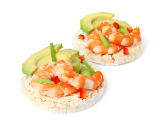 Puffed rice cakes with shrimps and avocado isolated on white