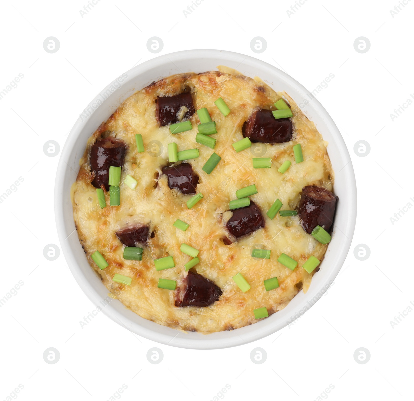 Photo of Tasty sausage casserole with green onions in baking dish isolated on white, top view