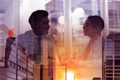 Image of Double exposure of business partners and cityscape