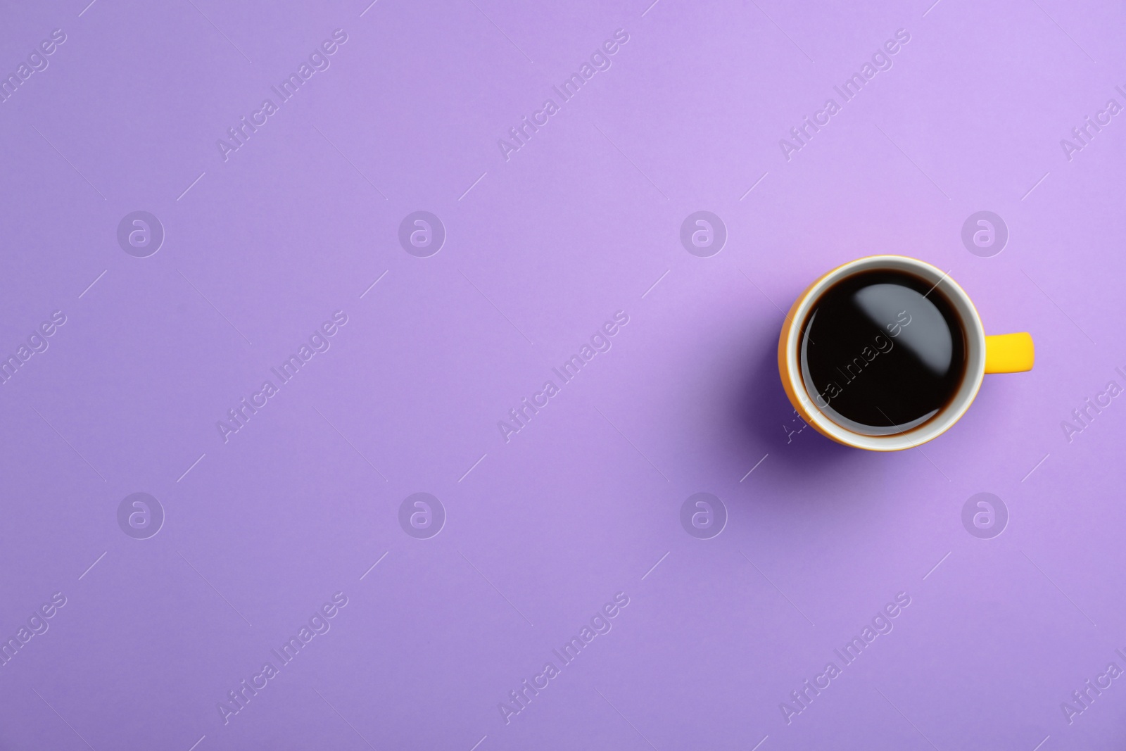 Photo of Ceramic cup with hot aromatic coffee on color background, top view