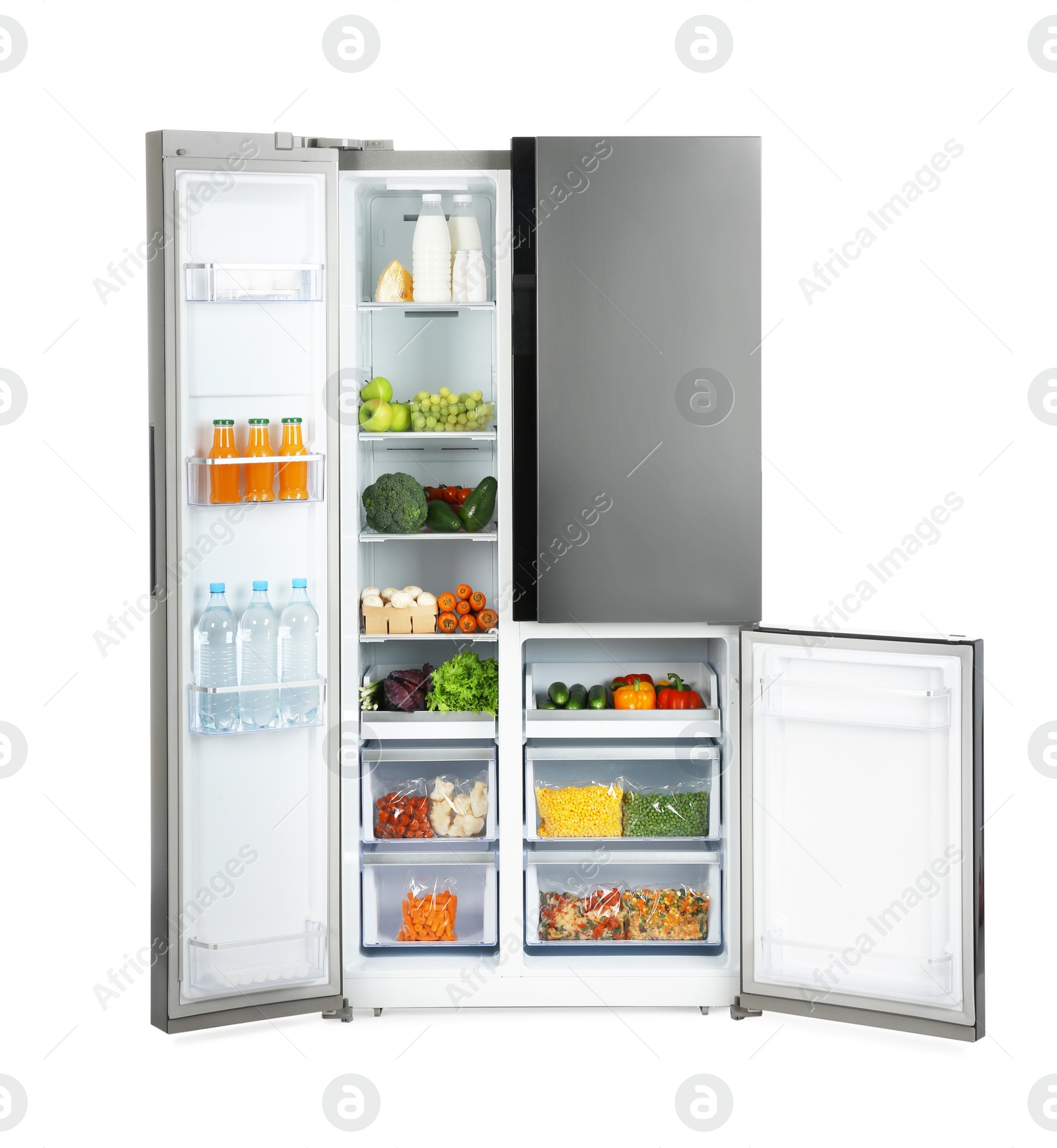 Photo of Open refrigerator filled with products isolated on white