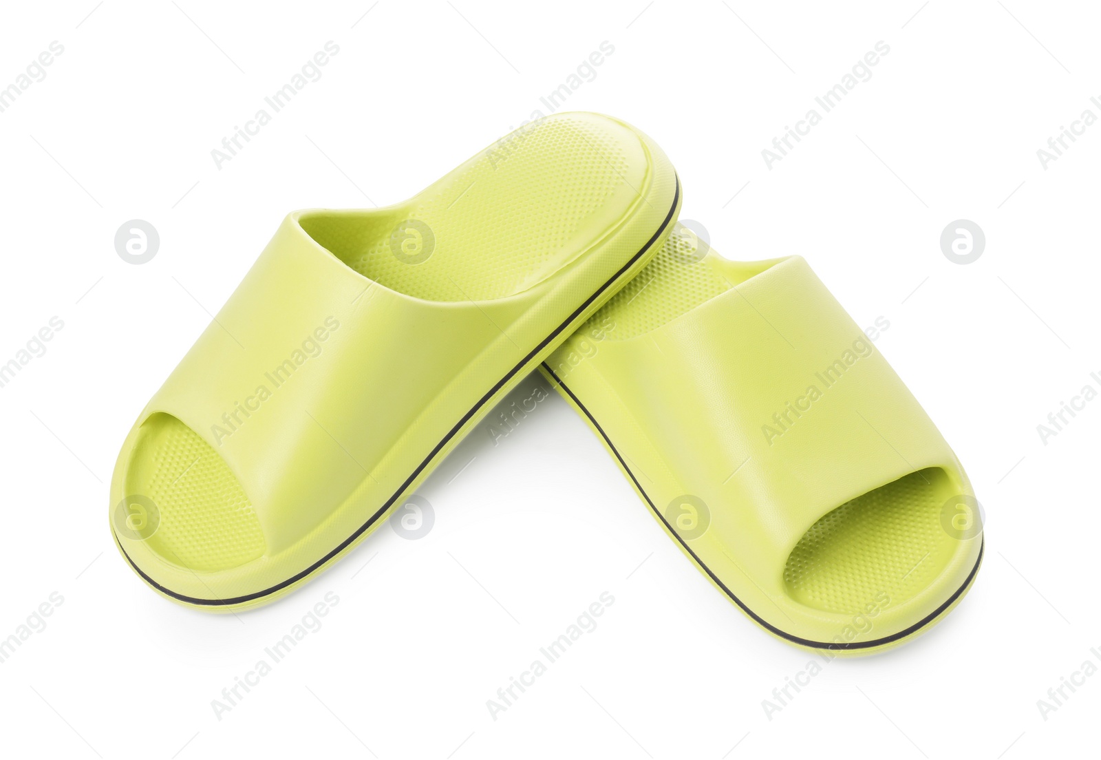 Photo of Pair of green rubber slippers isolated on white