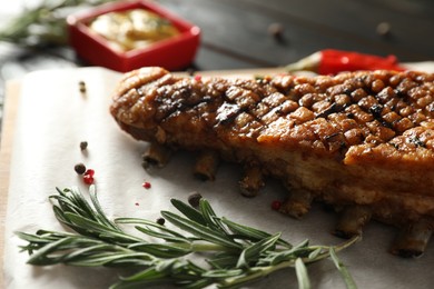 Photo of Delicious roasted ribs served on table, closeup