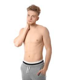 Photo of Portrait of young man with slim body on white background