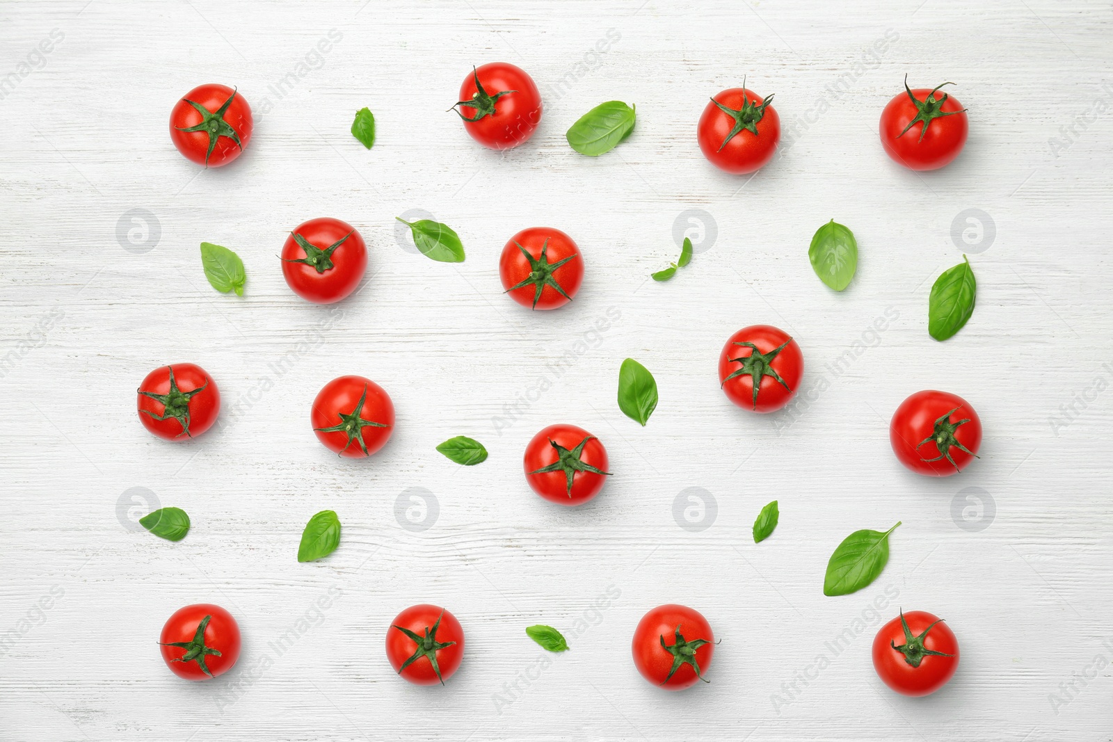 Photo of Flat lay composition with ripe tomatoes on wooden background