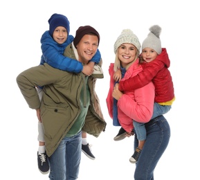 Happy family with children in warm clothes on white background. Winter season