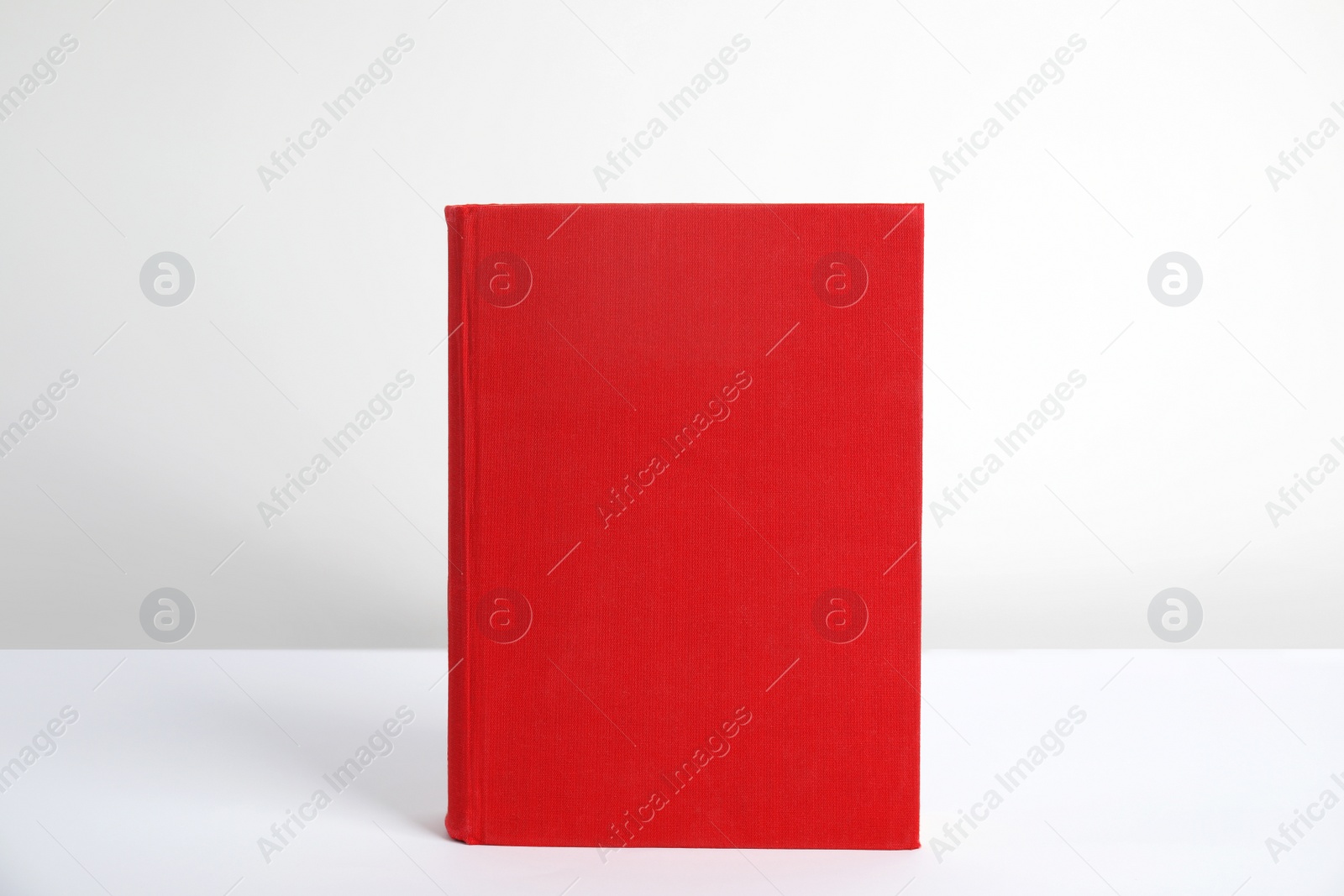 Photo of Blank book with hardcover on white background