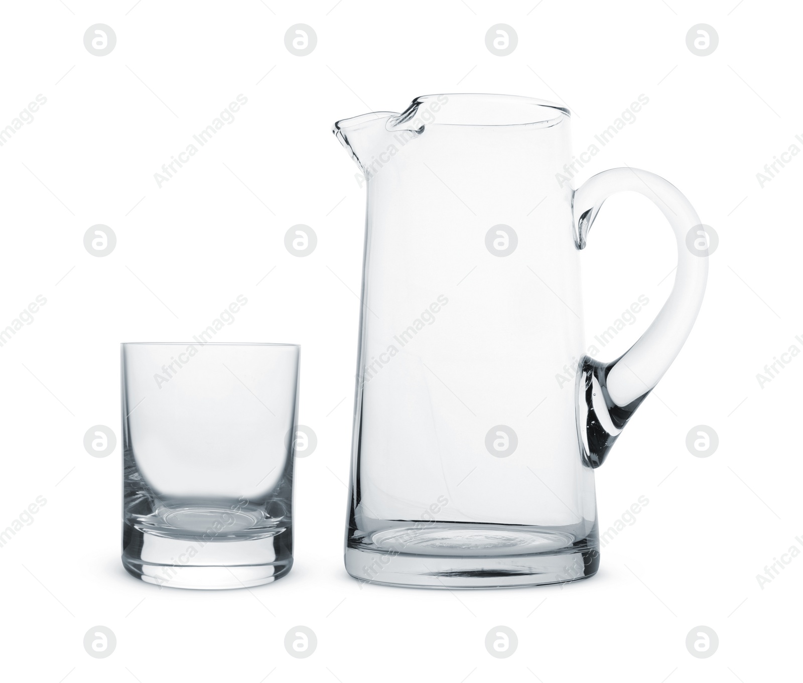 Image of Empty glass and jug isolated on white