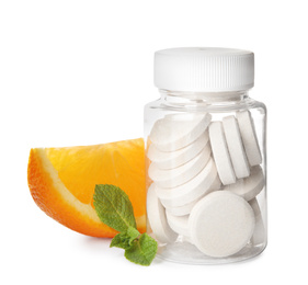 Photo of Bottle with vitamin pills, mint and orange on white background