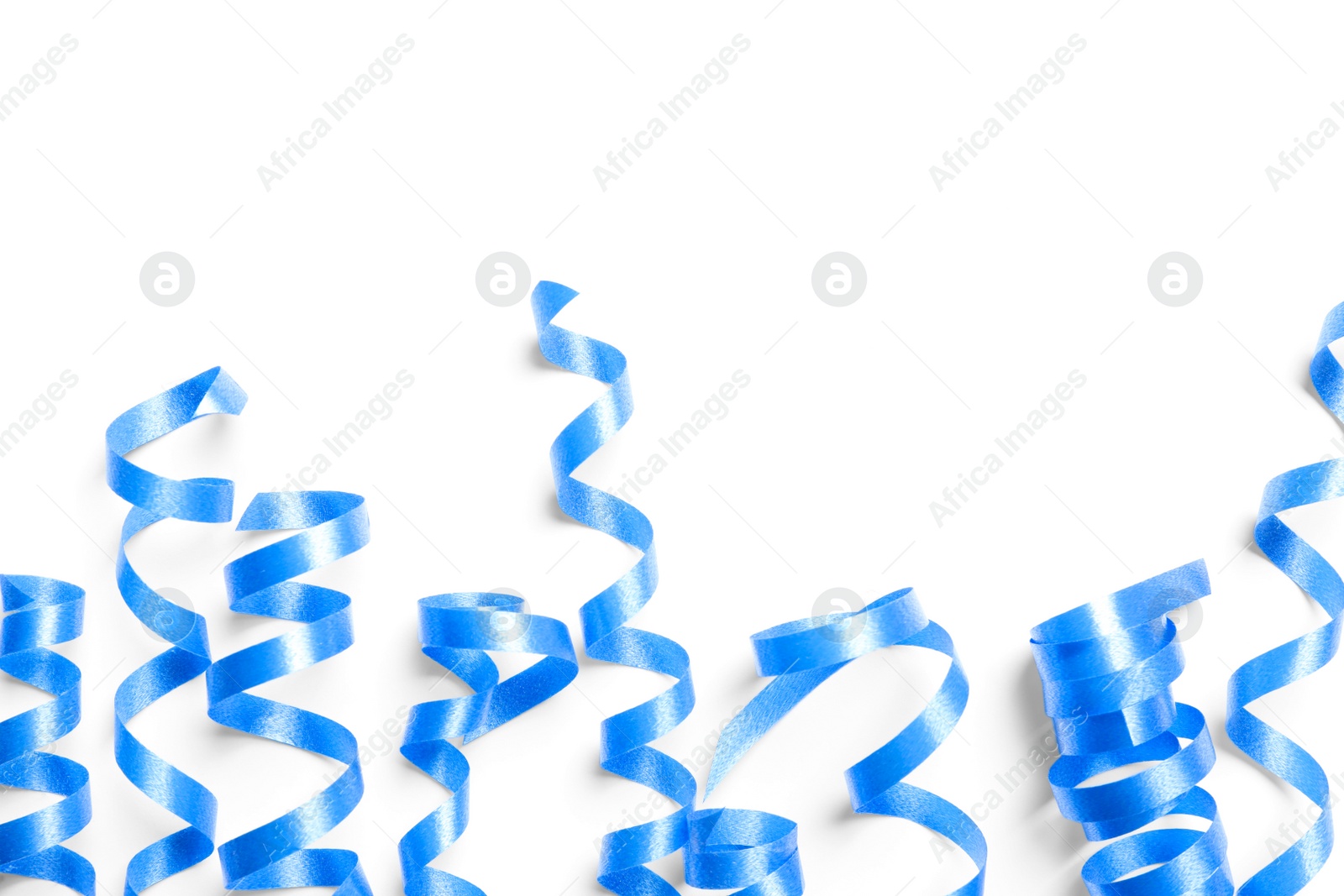 Photo of Blue serpentine streamers on white background, top view