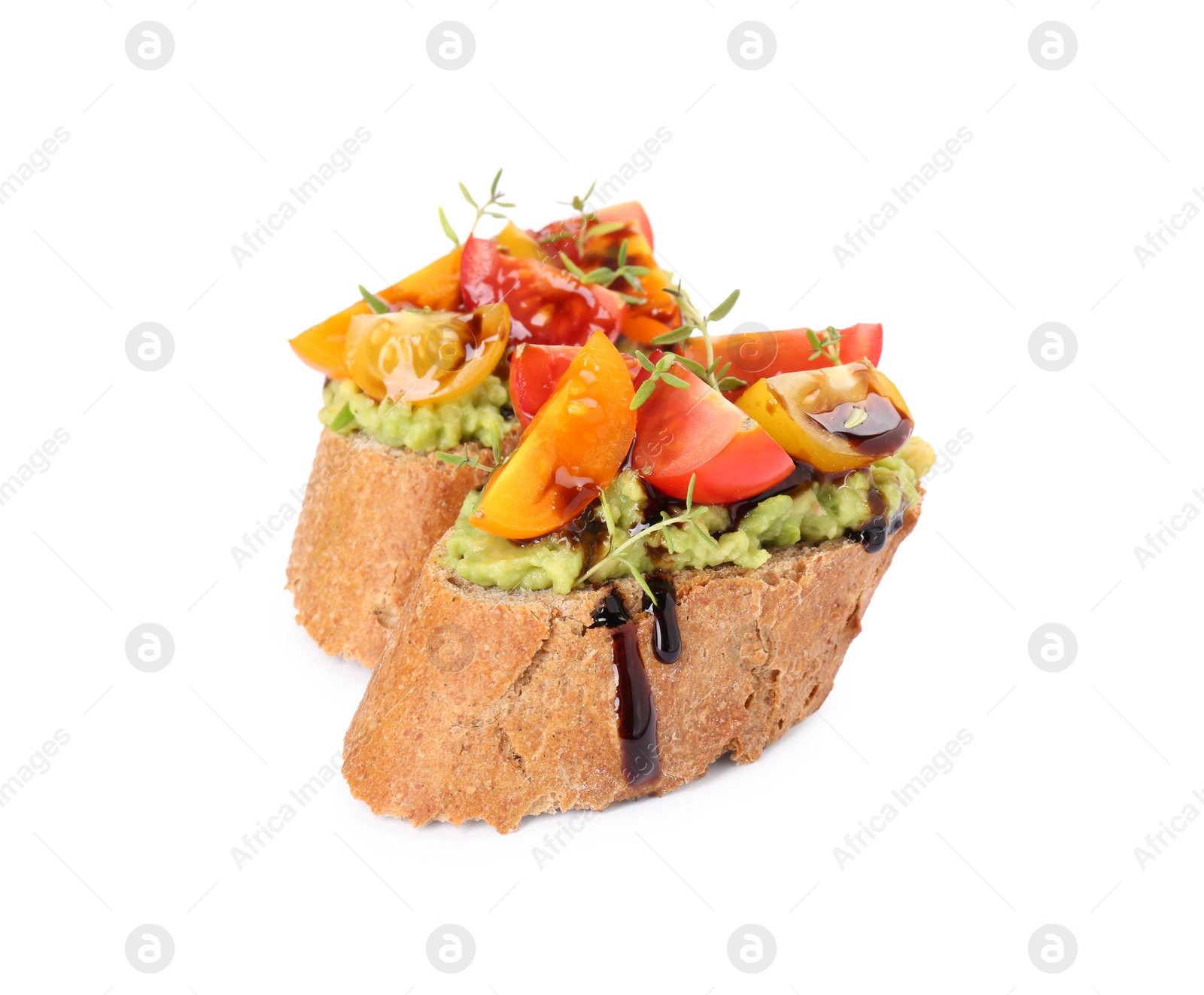 Photo of Delicious bruschettas with avocado, tomatoes and balsamic vinegar isolated on white