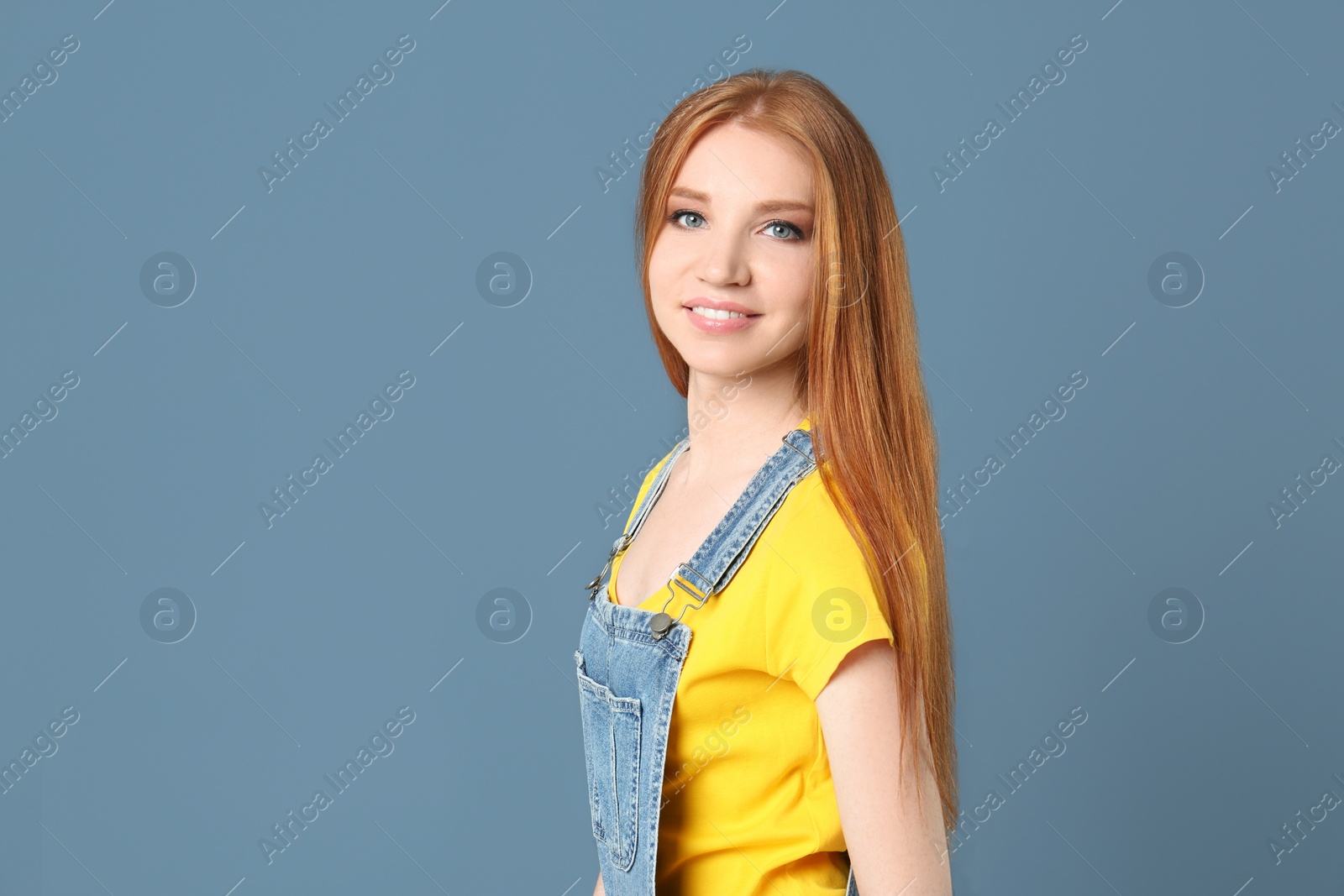 Photo of Portrait of young model with beautiful  hair on color background