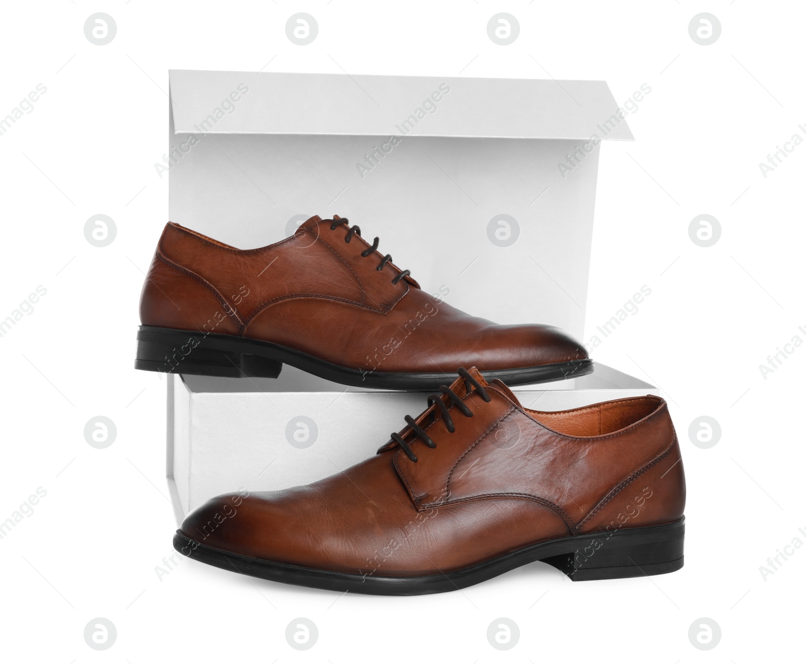 Photo of Pair of stylish leather shoes and box on white background