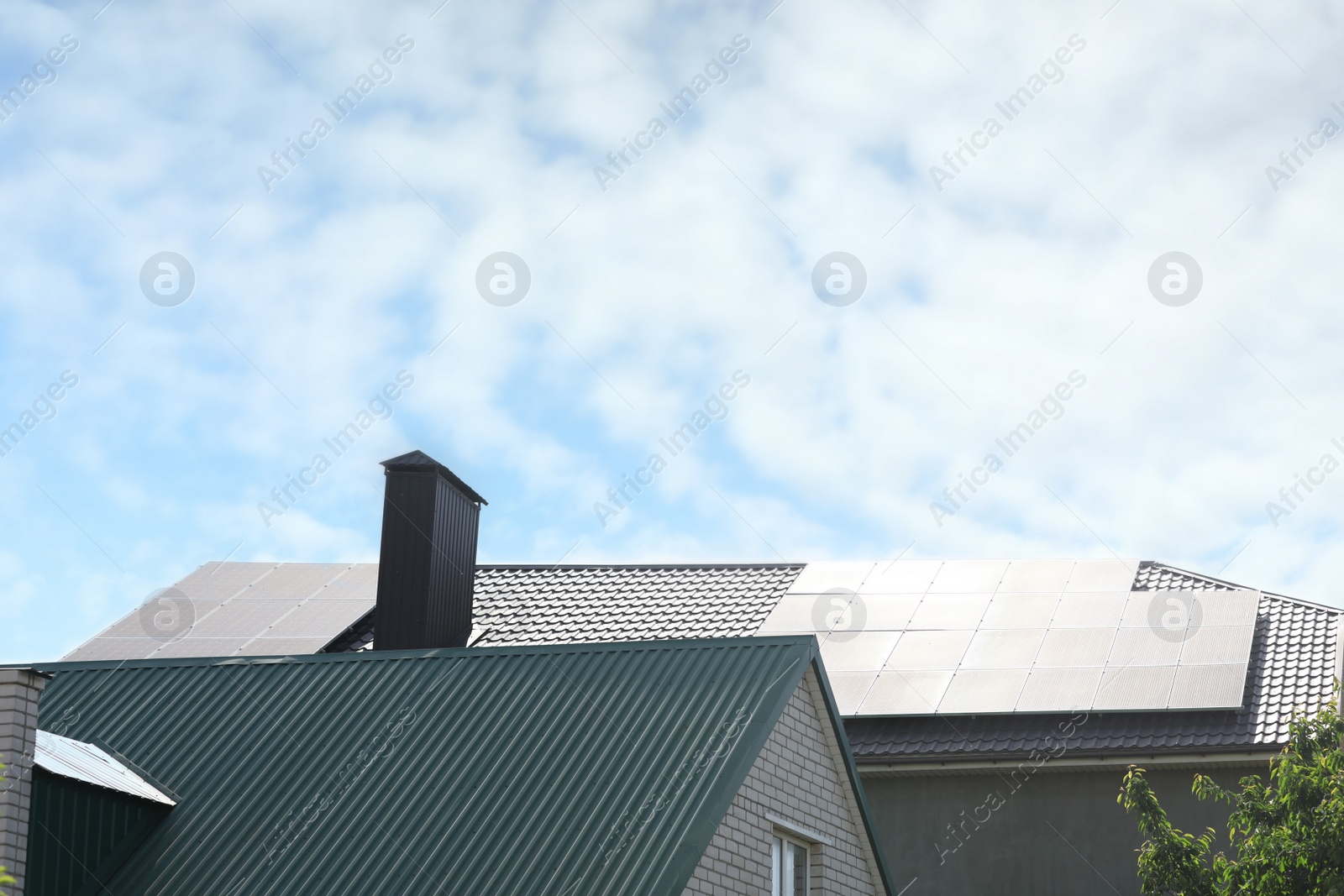 Photo of Modern house roof with solar panels outdoors