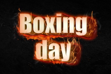 Image of Flaming text Boxing Day on black background