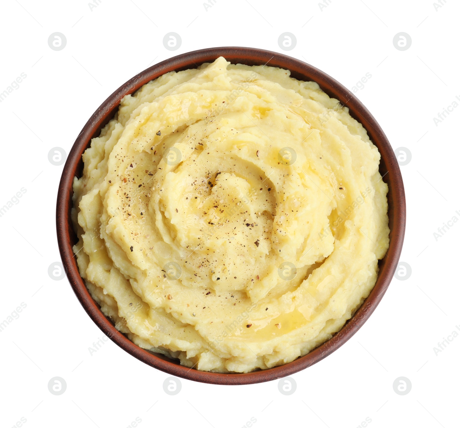 Photo of Bowl of tasty mashed potatoes with black pepper isolated on white, top view