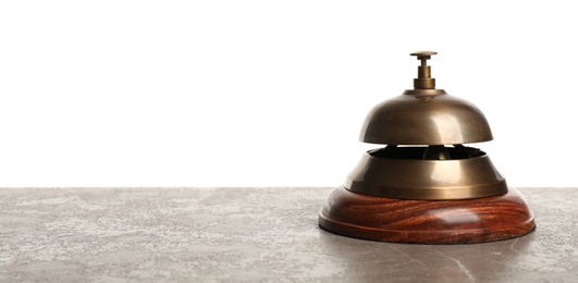 Photo of Hotel service bell on grey stone table against white background