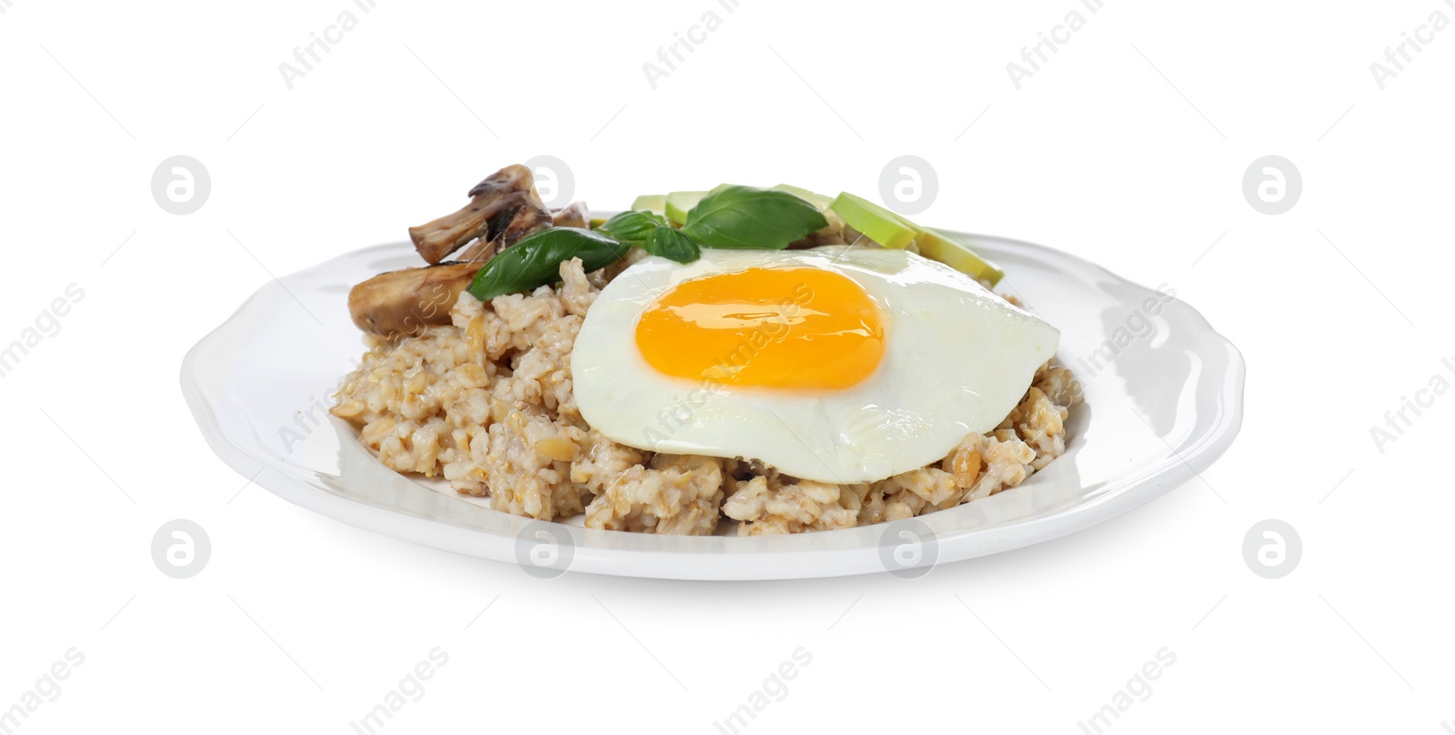 Photo of Tasty boiled oatmeal with fried egg, avocado and mushrooms isolated on white
