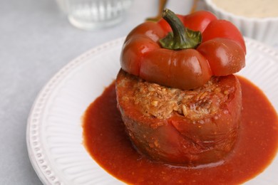 Photo of Delicious stuffed bell pepper on light table, closeup