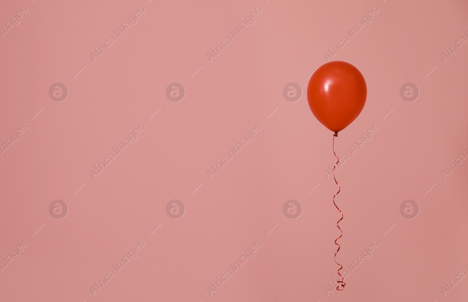 Photo of Bright balloon on color background, space for text. Celebration time