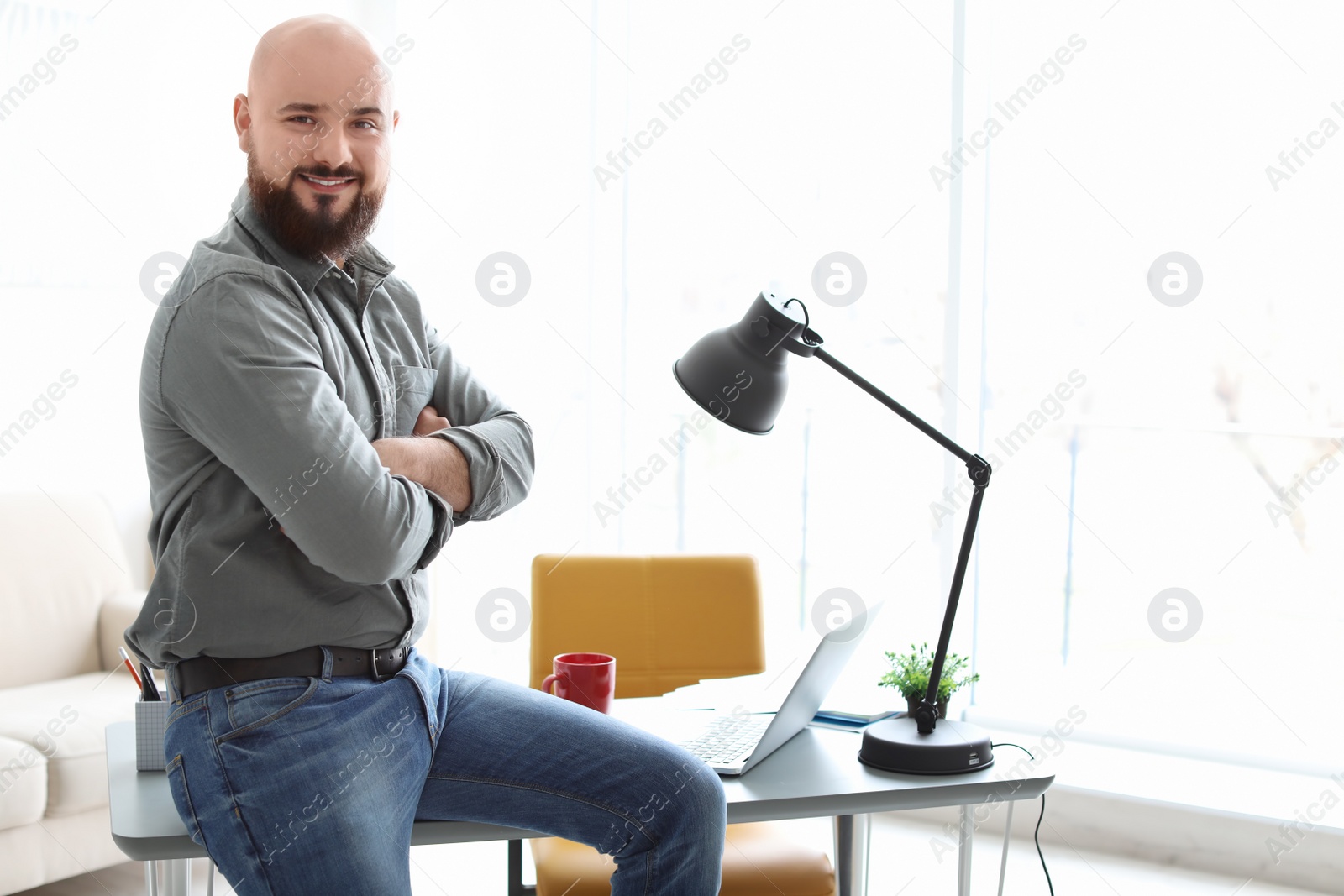 Photo of Portrait of confident young man in room