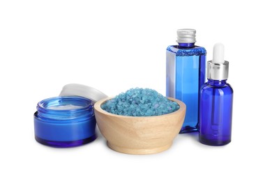 Photo of Spa composition. Cosmetic products and sea salt isolated on white