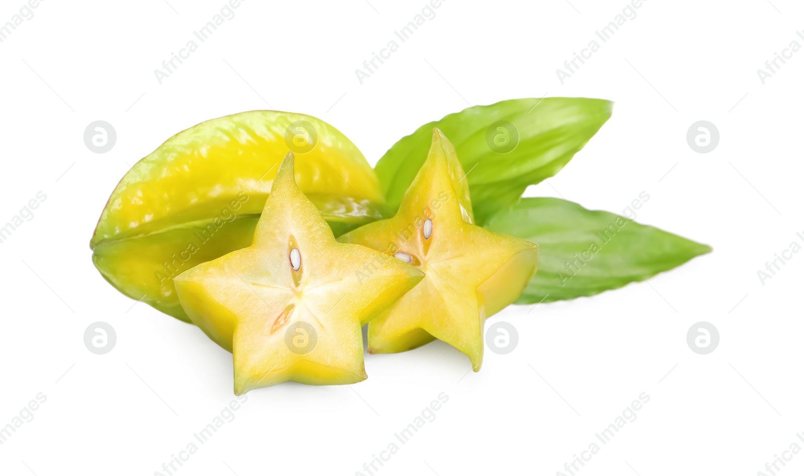 Photo of Cut and whole carambolas with green leaves on white background