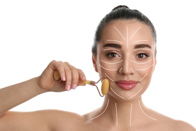 Woman using natural jade face roller on white background