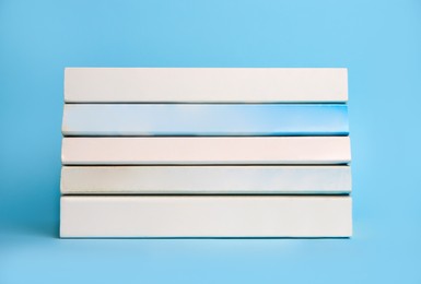 Photo of Collection of books on light blue background