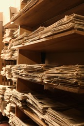 Image of Collection of old newspapers on shelves in library
