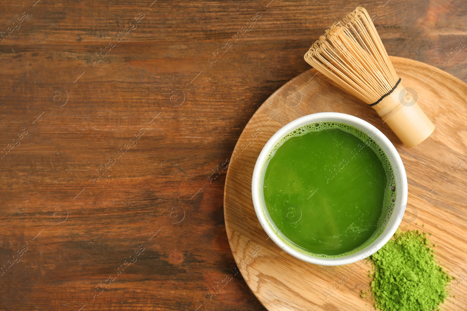 Photo of Flat lay composition with matcha tea on wooden background