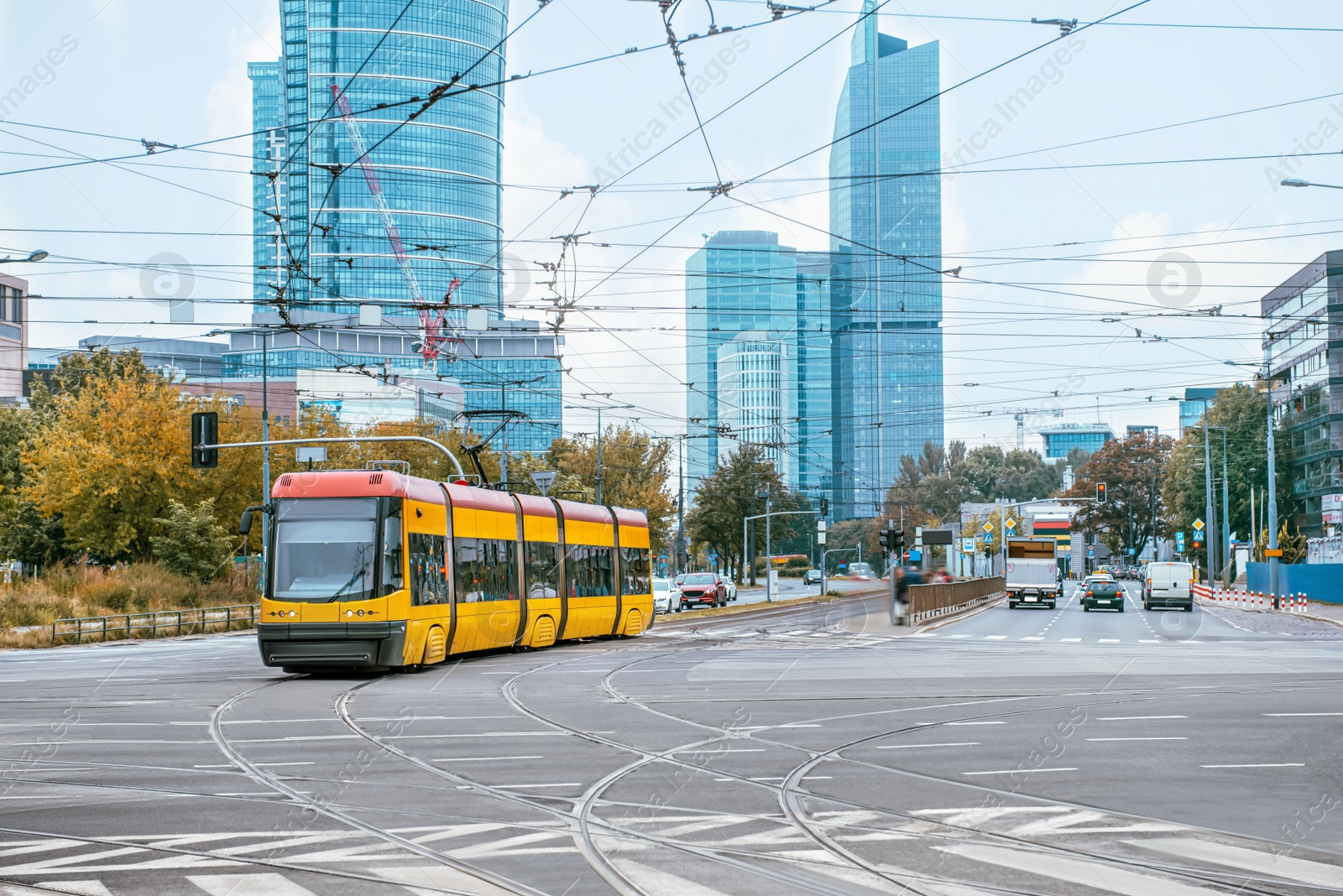 Photo of Modern tram on city street. Public transport