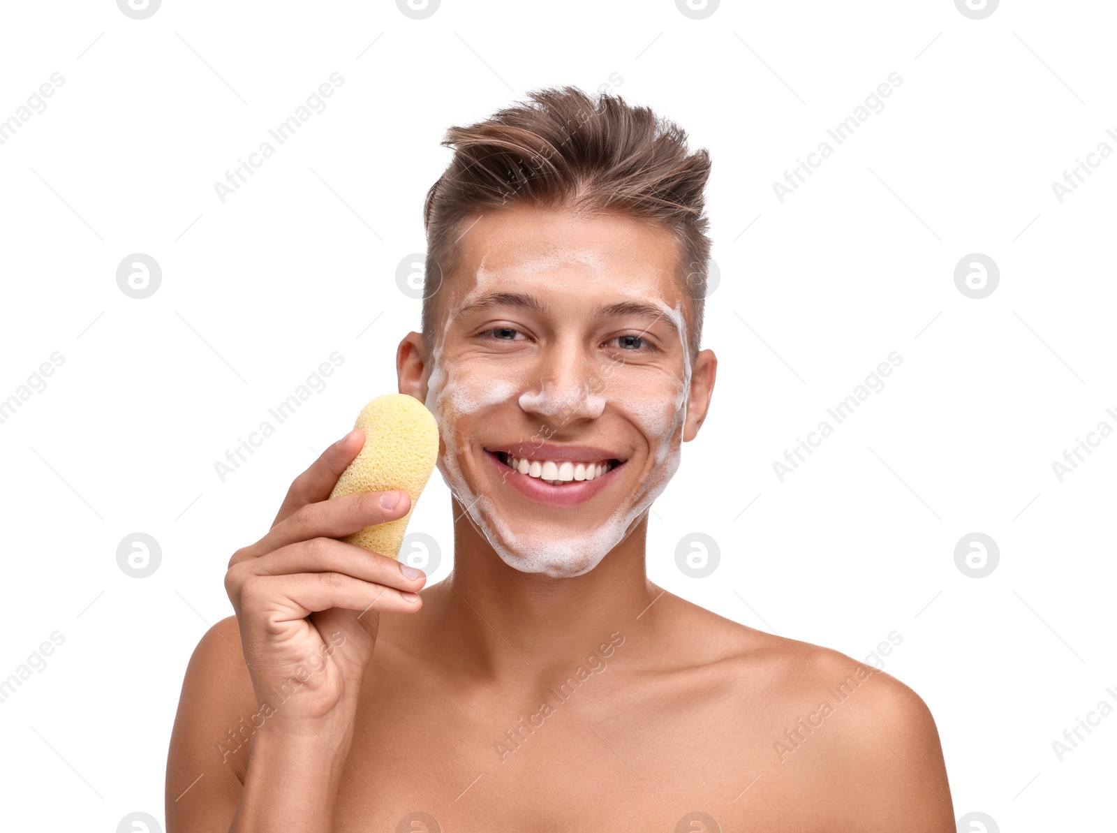 Photo of Happy young man washing his face with sponge on white background