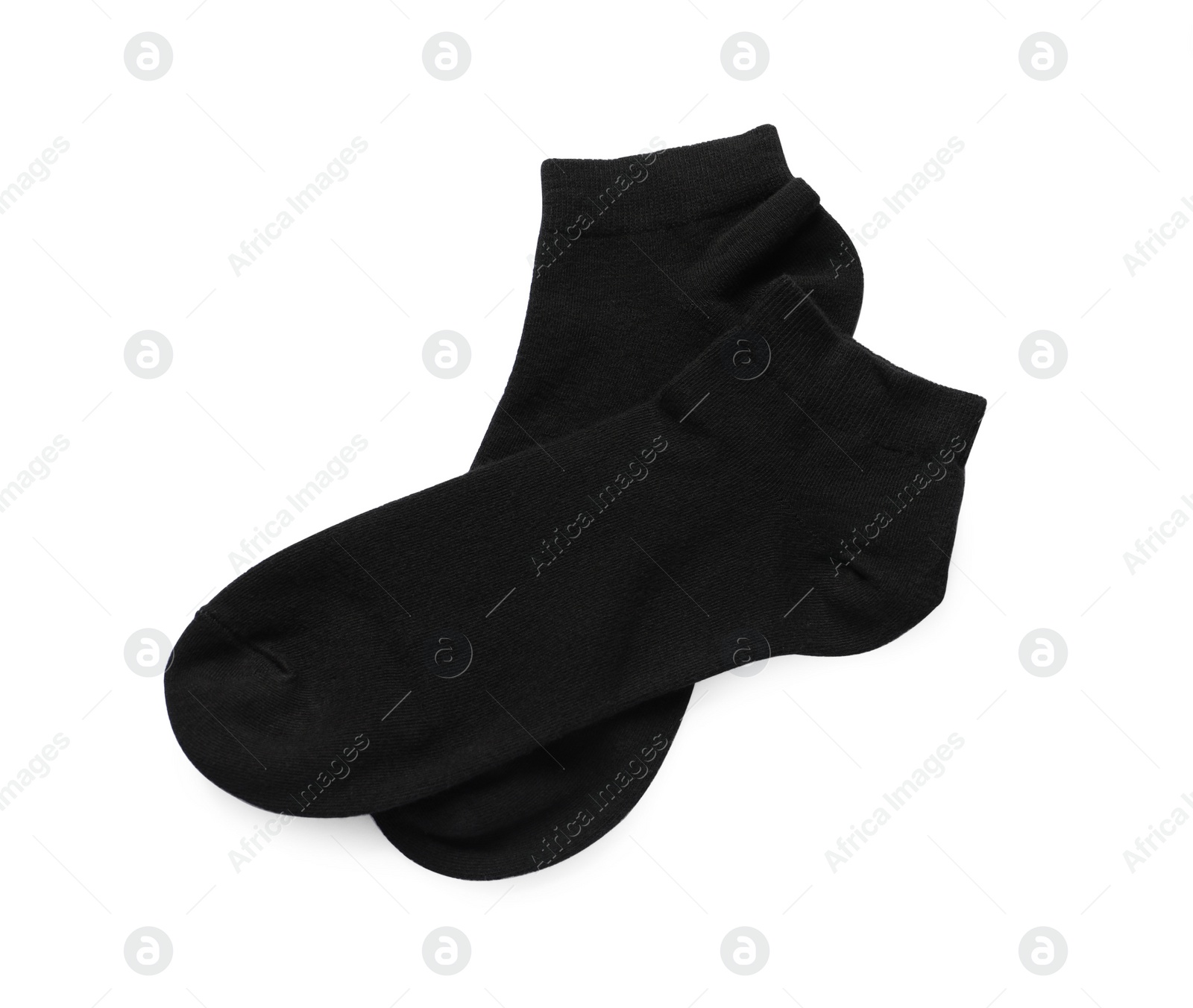 Photo of Pair of black socks on white background, top view