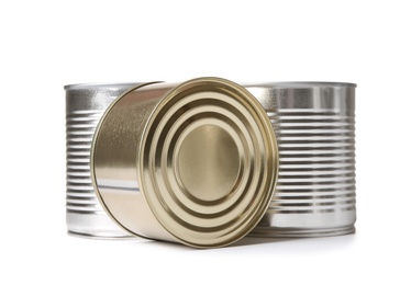 Photo of Closed tin cans isolated on white, mockup for design