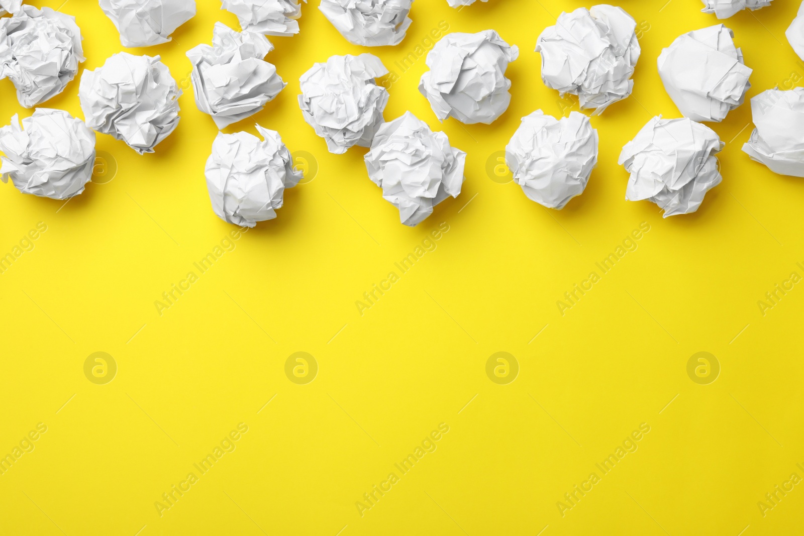 Photo of Paper balls on color background, flat lay. Space for text