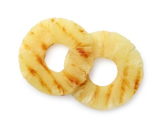 Photo of Tasty grilled pineapple slices isolated on white, top view