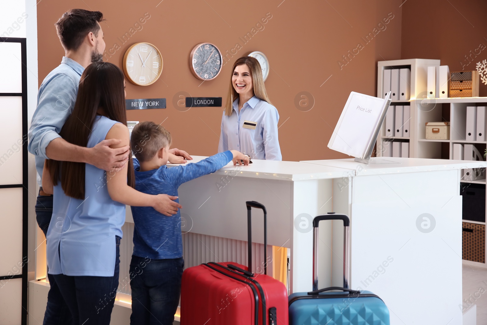 Photo of Family checking in at hotel reception