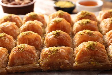 Delicious sweet baklava with pistachios on table, closeup