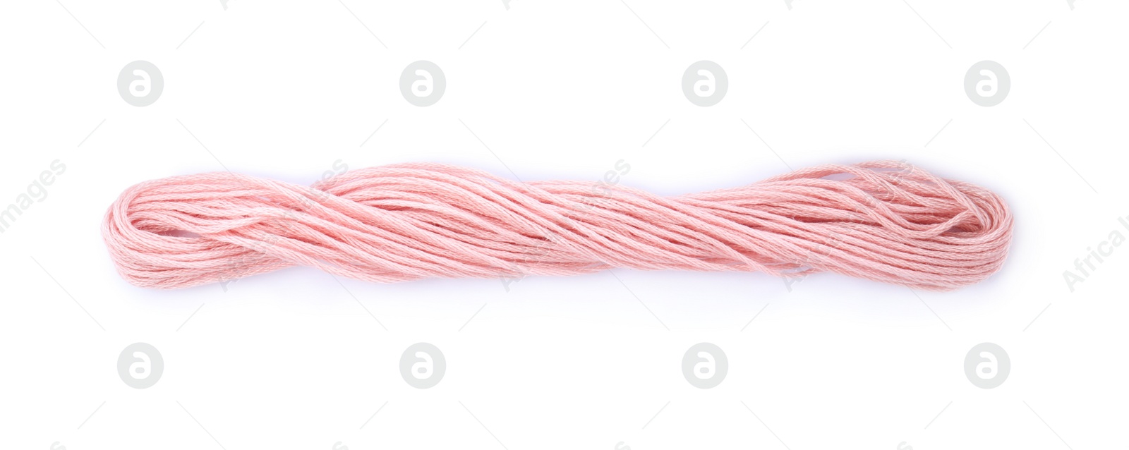 Photo of Bright pink embroidery thread on white background