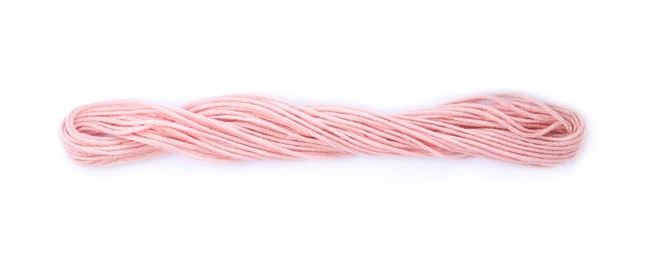 Bright pink embroidery thread on white background