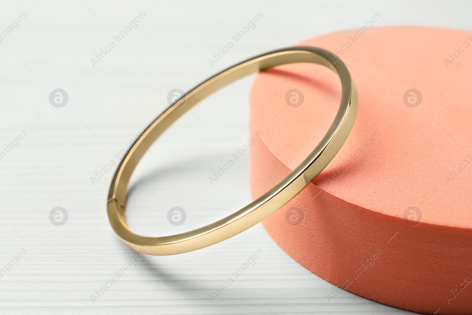 Photo of Stylish presentation of bracelet on podium, closeup