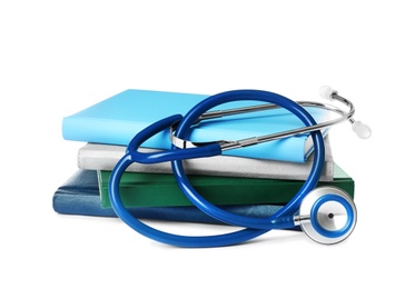 Stack of student textbooks and stethoscope on white background. Medical education