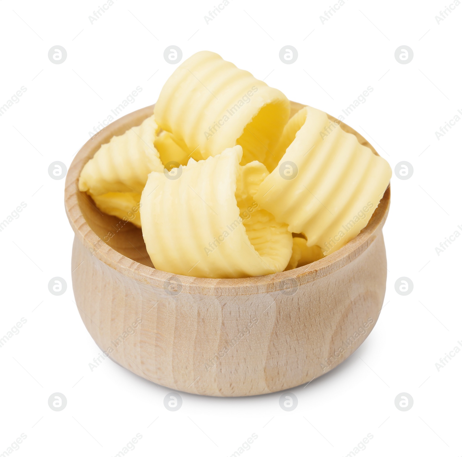 Photo of Tasty butter curls in bowl isolated on white