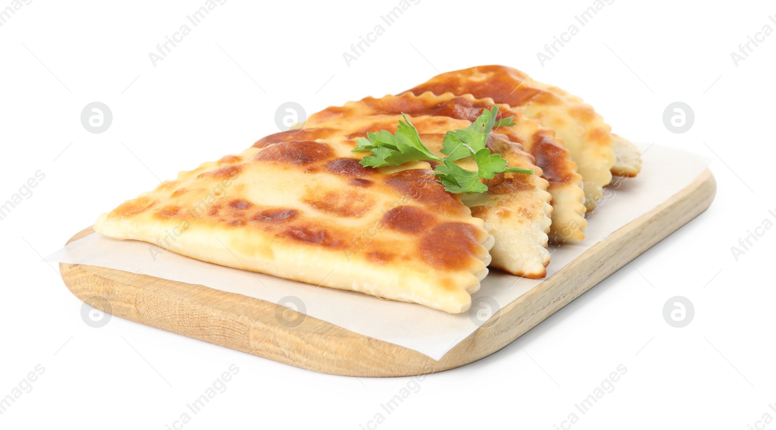 Photo of Board with delicious fried chebureki and parsley isolated on white