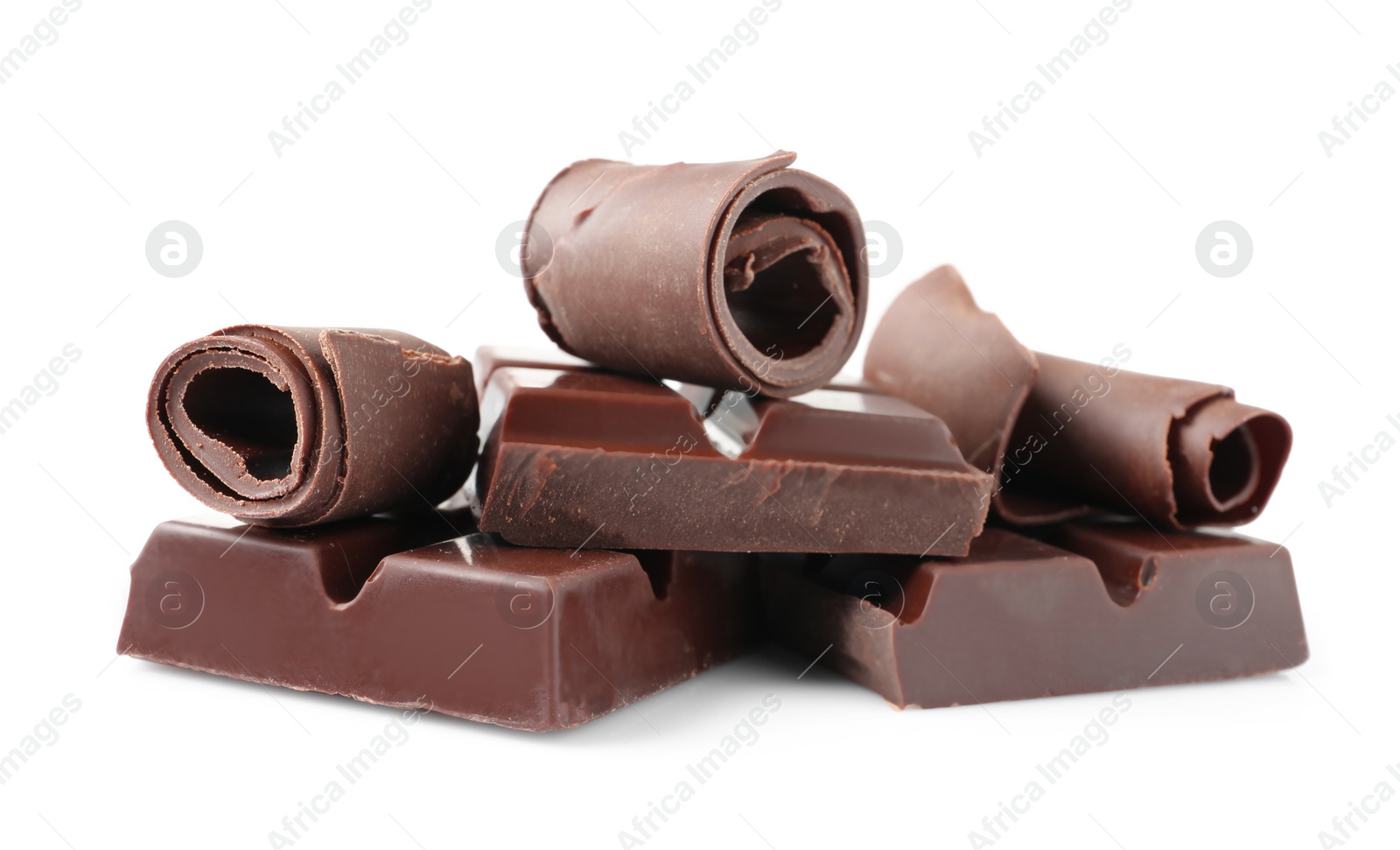 Photo of Yummy chocolate curls and pieces on white background