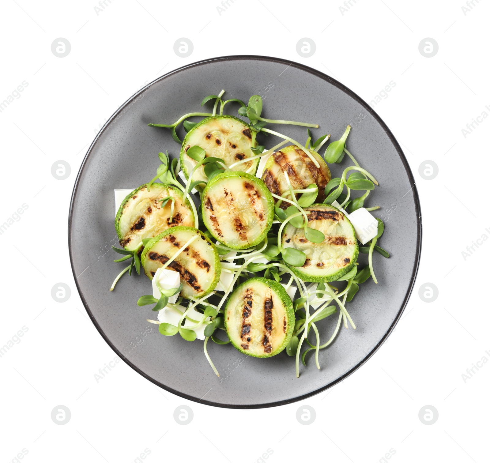 Photo of Delicious salad with grilled zucchini slices and feta cheese on white background, top view